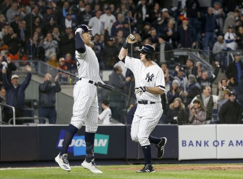 DJ LeMahieu #26 and Aaron Judge #99 of the New York Yankees celebrate against the Houston Astros in game five of the American League Championship Series at Yankee Stadium on October 18, 2019 in New York City. The Yankees defeated the Astros 4-1. (Photo by Jim McIsaac/Getty Images)