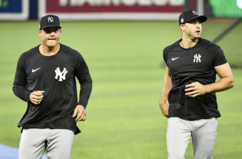 MIAMI, FL - JULY 30: Anthony Rizzo #48 and Joey Gallo #13 of the New York Yankees warm up before the game against the Miami Marlins at loanDepot park on July 30, 2021 in Miami, Florida. (Photo by Eric Espada/Getty Images)