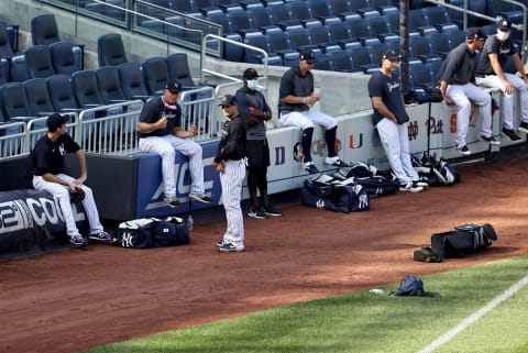 The next group to work out waits on the side of the field during summer workouts at Yankee Stadium on July 04, 2020 in the Bronx borough of New York City. (Photo by Elsa/Getty Images)