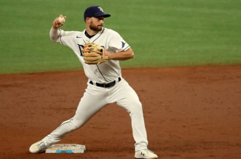 ST PETERSBURG, FLORIDA - AUGUST 08: Brandon Lowe #8 of the Tampa Bay Rays makes a throw to first during Game 2 of a double header against the New York Yankees at Tropicana Field on August 08, 2020 in St Petersburg, Florida. (Photo by Mike Ehrmann/Getty Images)