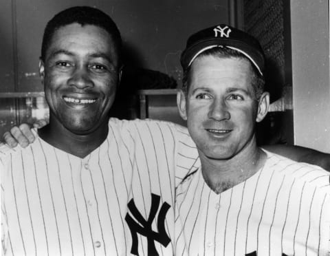 Whitey Ford, right, and Elston Howard of the New York Yankees – (Photo Reproduction by Transcendental Graphics/Getty Images)