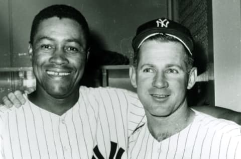 NEW YORK, NY – CIRCA 1965: Whitey Ford, right, and Elston Howard of the New York Yankees pose for a clubhouse photo circa 1965 In Yankee Stadium in New York City. (Photo Reproduction by Transcendental Graphics/Getty Images)