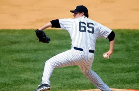 NEW YORK, NY – JUNE 27: Phil Hughes #65 of the New York Yankees in action against the Texas Rangers at Yankee Stadium on June 27, 2013 in the Bronx borough of New York City. The Rangers defeated the Yankees 2-0. (Photo by Jim McIsaac/Getty Images)