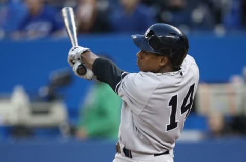 TORONTO, CANADA – SEPTEMBER 18: Curtis Granderson #14 of the New York Yankees bats in the first inning during MLB game action against the Toronto Blue Jays on September 18, 2013 at Rogers Centre in Toronto, Ontario, Canada. (Photo by Tom Szczerbowski/Getty Images)