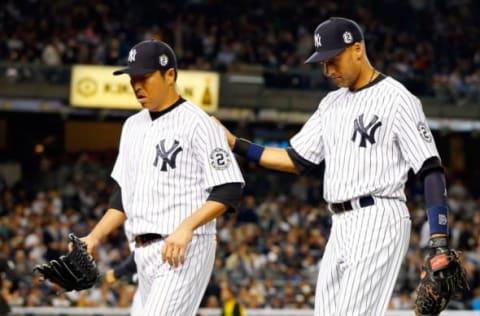 NEW YORK, NY – SEPTEMBER 25: (NEW YORK DAILIES OUT) Derek Jeter #2 and Hiroki Kuroda #18 of the New York Yankees walk to the dugout after the seventh inning against the Baltimore Orioles at Yankee Stadium on Thursday, September 25, 2014 in the Bronx Borough of New York City.The game was Jeter’s last at Yankee Stadium and the Yankees defeated the Orioles 6-5. (Photo by Jim McIsaac/Getty Images)