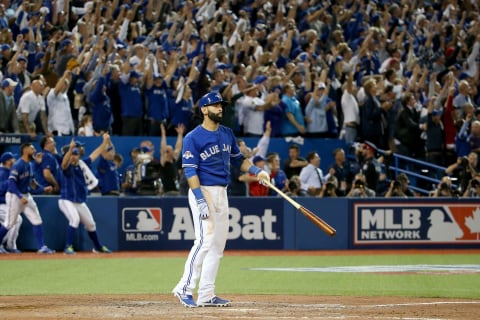 TORONTO, ON – OCTOBER 14: Jose Bautista #19 of the Toronto Blue Jays flips his bat up in the air after he hits a three-run home run in the seventh inning against the Texas Rangers in game five of the American League Division Series at Rogers Centre on October 14, 2015 in Toronto, Canada. (Photo by Tom Szczerbowski/Getty Images)