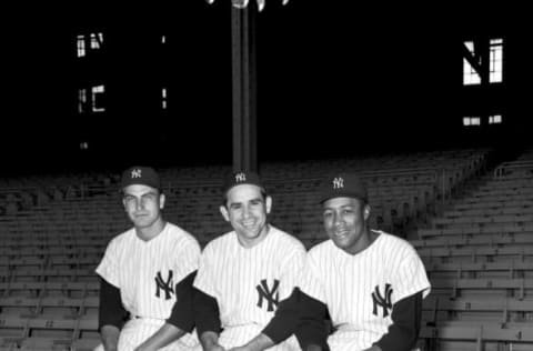 BRONX, NY – 1957: (l to r) Catchers, Darrell Johnson #39, Yogi Berra #8 and Elston Howard #32, of the New York Yankees, pose for the camera at Yankee Stadium in New York in 1957. (Olen Collection/Diamond Images/Getty Images)