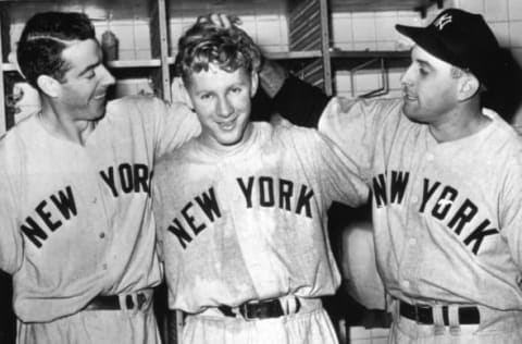 DETROIT – SEPTEMBER 16, 1950. Whitey Ford, center is congratulated by Joe DiMaggio, left, and Gene Woodling after Ford’s six-hit shutout vaulted the Yankees back into first place in the American League pennant race on September 16, 1950. (Photo by Mark Rucker/Transcendental Graphics, Getty Images)