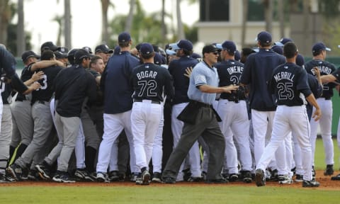 Players of the Tampa Bay Rays and the New York Yankees square off after a hard slide by first baseman Shelley Duncan #17 (Photo by Al Messerschmidt/Getty Images).