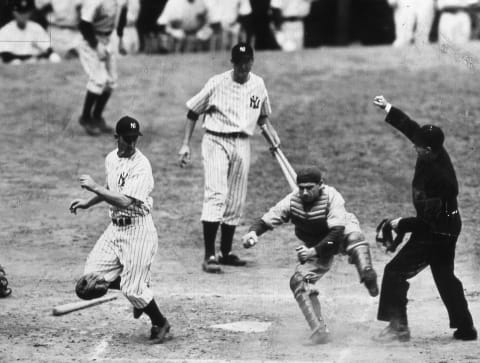 Catcher Mickey Owen of the Brooklyn Dodgers has just tagged out Joe Gordon (left) of the New York Yankees – (Photo by Mark Rucker/Transcendental Graphics, Getty Images)