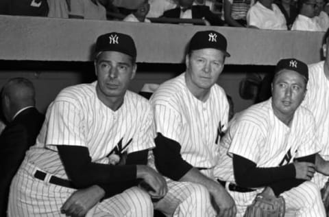 Former outfielder Joe DiMaggio #5, pitcher Spurgeon “Spud” Chandler #21 and infielder George “Snuffy” Stirnweiss #1 of the New York Yankees – (Photo by: Olen Collection/Diamond Images/Getty Images)