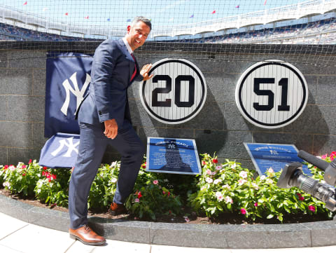 Former New York Yankee Jorge Posada admires his plaque. (Photo by Jim McIsaac/Getty Images)