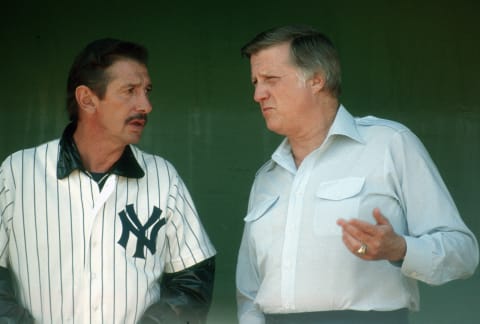 Manager Billy Martin #1 of the New York Yankees talks with owner George Steinbrenner – (Photo by Focus on Sport/Getty Images)