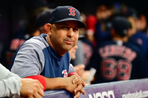 Former Boston Red Sox manager Alex Cora, with an S-eating grin (Photo by Julio Aguilar/Getty Images)