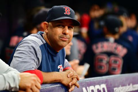 Former Boston Red Sox manager Alex Cora, with an S-eating grin (Photo by Julio Aguilar/Getty Images)