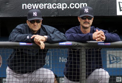 Manager Joe Torre (L) and hitting coach Don Mattingly (R) of the New York Yankees (Photo by Jim McIsaac/Getty Images)