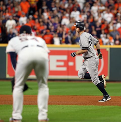 DJ LeMahieu #26 of the New York Yankees hits a two run home run in the ninth inning against the Houston Astros (Photo by Bob Levey/Getty Images)