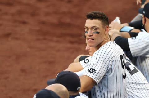 NEW YORK, NEW YORK - JULY 31: Aaron Judge #99 of the New York Yankees looks on from the dugout against the Boston Red Sox during their home opener at Yankee Stadium on July 31, 2020 in New York City. The 2020 season had been postponed since March due to the COVID-19 pandemic. (Photo by Al Bello/Getty Images)