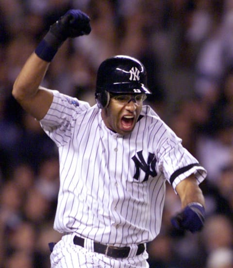 Jose Vizcaino of the New York Yankees celebrates his game winning single in the 12th inning against the New York Mets in game 1 of the World Series 21 October 2000, at Yankee Stadium in New York, NY. (JEFF HAYNES/AFP via Getty Images)