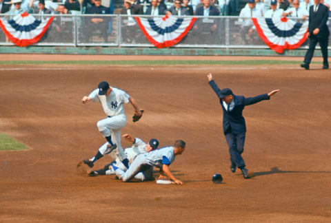 Maury Wills #30 of the Los Angeles Dodgers slides into second base against the New York Yankees during the 1963 World Series (Photo by Focus on Sport/Getty Images)