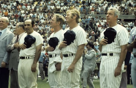 Gabe Paul, Joe McCarthy, Yogi Berra #8, Whitey Ford #16, Mickey Mantle #7 and Joe Dimaggio #5 of the New York Yankees(Photo by: Olen Collection/Diamond Images/Getty Images)