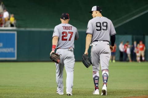 WASHINGTON, DC - JULY 17: Mike Trout #27 of the Los Angeles Angels of Anaheim and the American League and Aaron Judge #99 of the New York Yankees and the American League take the field in the sixth inning against the National League during the 89th MLB All-Star Game, presented by Mastercard at Nationals Park on July 17, 2018 in Washington, DC. (Photo by Rob Carr/Getty Images)