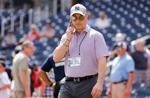 New York Yankees general manager Brian Cashman talks on the phone prior to a Grapefruit League spring training game between the Washington Nationals and the New York Yankees at FITTEAM Ballpark of The Palm Beaches on March 12, 2020 in West Palm Beach, Florida. Many professional and college sports are canceling or postponing their games due to the ongoing threat of the Coronavirus (COVID-19) outbreak. (Photo by Michael Reaves/Getty Images)