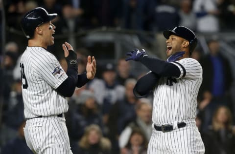 NEW YORK, NEW YORK - OCTOBER 18: (NEW YORK DAILIES OUT) Aaron Hicks #31 of the New York Yankees celebrates his home run in game five of the American League Championship Series against the Houston Astros with teammate Aaron Judge #99 at Yankee Stadium on October 18, 2019 in New York City. The Yankees defeated the Astros 4-1. (Photo by Jim McIsaac/Getty Images)