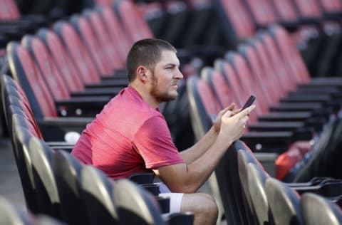 CINCINNATI, OH - JULY 18: Cincinnati Reds pitcher Trevor Bauer looks on while on his cell phone during a team scrimmage at Great American Ball Park on July 18, 2020 in Cincinnati, Ohio. (Photo by Joe Robbins/Getty Images)