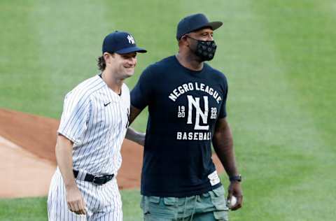 Former New York Yankee CC Sabathia poses for a photograph with Gerrit Cole #45 after throwing out the ceremonial first pitch before the Yankees home opener against the Boston Red Sox at Yankee Stadium on July 31, 2020 in New York City. The Yankees defeated the Red Sox 5-1. (Photo by Jim McIsaac/Getty Images)