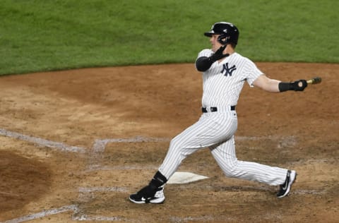 NEW YORK, NEW YORK - AUGUST 03: Luke Voit #59 of the New York Yankees follows through after swinging at a pitch during the eighth inning against the Philadelphia Phillies at Yankee Stadium on August 03, 2020 in the Bronx borough of New York City. (Photo by Sarah Stier/Getty Images)