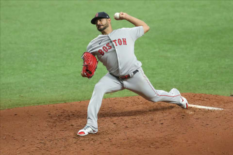 Martin Perez #54 of the Boston Red Sox throws against the Tampa Bay Rays in the fourth inning of a baseball game at Tropicana Field on August 5, 2020 in St. Petersburg, Florida. (Photo by Mike Carlson/Getty Images)