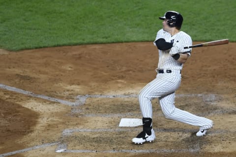 Luke Voit #59 of the New York Yankees follows through after hitting a two-run home run during the fifth inning against the Tampa Bay Rays at Yankee Stadium on August 18, 2020 in the Bronx borough of New York City. (Photo by Sarah Stier/Getty Images)