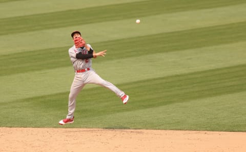 Andrelton Simmons #2 of the Los Angeles Angels makes a play on a ball hit by Marcus Semien #10 of the Oakland Athletics in the sixth inning at RingCentral Coliseum on August 23, 2020 in Oakland, California. (Photo by Ezra Shaw/Getty Images)