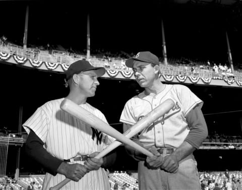 Enos Slaughter #17 of the New York Yankees and Gil Hodges #14 of the Brooklyn Dodgers pose for a portrait prior to World Series Game 2 on September 29, 1955 at Yankee Stadium in the Bronx, New York. Tommy Byrne and the Yankees won the second game of the series 4-2, in front of 64,707 fans. (Photo by Kidwiler Collection/Diamond Images/Getty Images)