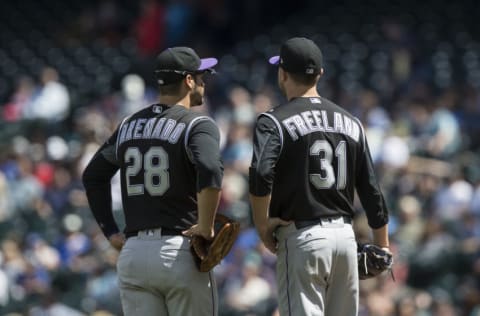 SEATTLE, WA - JUNE 1: Third baseman Nolan Arenado #28 of the Colorado Rockies and starting pitcher Kyle Freeland #31 of the Colorado Rockies meet at the pitcher's mound during a game against the Seattle Mariners at Safeco Field on June 1, 2017 in Seattle, Washington. The Rockies won the game 6-3. (Photo by Stephen Brashear/Getty Images)