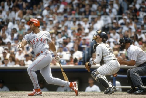 Outfielder Juan Gonzalez #19 of the Texas Rangers bats against the New York Yankees during an Major League Baseball game circa 1995 at Yankee Stadium in the Bronx borough of New York City. Gonzalez played for the Rangers from 1989-99 and 2002-2003. (Photo by Focus on Sport/Getty Images)