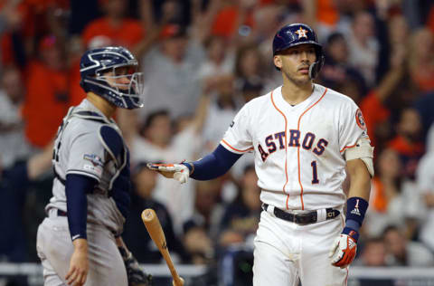 HOUSTON, TEXAS - OCTOBER 13: Carlos Correa #1 of the Houston Astros hits a walk-off home run in the eleventh inning against the New York Yankees during game two of the American League Championship Series at Minute Maid Park on October 13, 2019 in Houston, Texas. (Photo by Bob Levey/Getty Images)