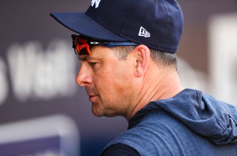 New York Yankees manager Aaron Boone #17 looks on from the dugout during the sixth inning of a spring training game against the Boston Red Sox at Steinbrenner Field on March 3, 2020 in Tampa, Florida. (Photo by Carmen Mandato/Getty Images)