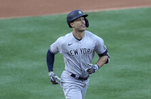 WASHINGTON, DC - JULY 23: Giancarlo Stanton #27 of the New York Yankees rounds the bases after hitting a two run home run to center field against Max Scherzer #31 of the Washington Nationals during the first inning in the game at Nationals Park on July 23, 2020 in Washington, DC. (Photo by Rob Carr/Getty Images)