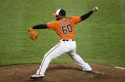 Mychal Givens #60 of the Baltimore Orioles pitches against the Boston Red Sox during the seventh inning at Oriole Park at Camden Yards on August 22, 2020 in Baltimore, Maryland. (Photo by Scott Taetsch/Getty Images)