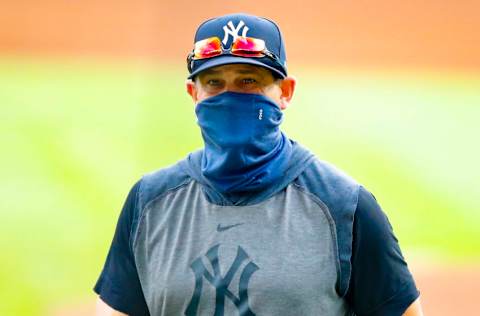 New York Yankees manager Aaron Boone returns to the dugout in the sixth inning of game one of the MLB doubleheader against the Atlanta Braves at Truist Park on August 26, 2020 in Atlanta, Georgia. (Photo by Todd Kirkland/Getty Images)