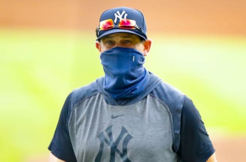 New York Yankees manager Aaron Boone returns to the dugout in the sixth inning of game one of the MLB doubleheader against the Atlanta Braves at Truist Park on August 26, 2020 in Atlanta, Georgia. (Photo by Todd Kirkland/Getty Images)