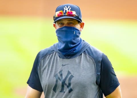 New York Yankees manager Aaron Boone returns to the dugout in the sixth inning of game one of the MLB doubleheader against the Atlanta Braves at Truist Park on August 26, 2020 in Atlanta, Georgia. (Photo by Todd Kirkland/Getty Images)