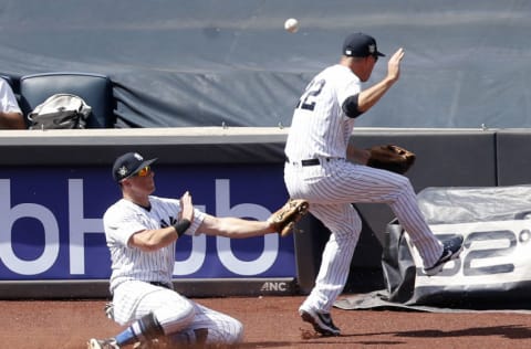 NEW YORK, NEW YORK - AUGUST 30: DJ LeMahieu #26 (L) and Jordy Mercer #22 of the New York Yankees in action against the New York Mets at Yankee Stadium on August 30, 2020 in New York City. The Yankees defeated the Mets 8-7. (Photo by Jim McIsaac/Getty Images)