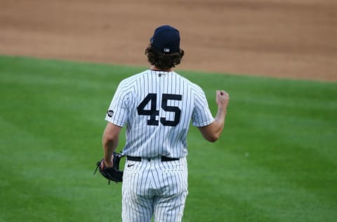 NEW YORK, NEW YORK - SEPTEMBER 11: Gerrit Cole #45 of the New York Yankees celebrates after defeating the Baltimore Orioles 6-0 at Yankee Stadium on September 11, 2020 in New York City. (Photo by Mike Stobe/Getty Images)