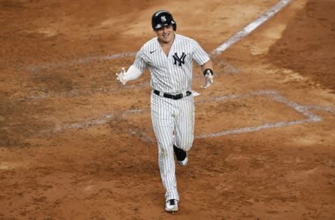 Luke Voit #59 of the New York Yankees reacts after hitting a home run during the fourth inning against the Toronto Blue Jays at Yankee Stadium on September 17, 2020 in the Bronx borough of New York City. (Photo by Sarah Stier/Getty Images)