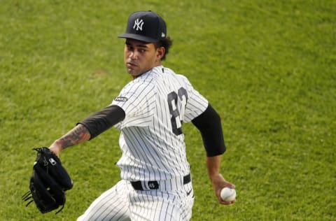 Deivi Garcia #83 of the New York Yankees warms up before a game against the Toronto Blue Jays at Yankee Stadium on September 15, 2020 in New York City. The Yankees defeated the Blue Jays 20-6. (Photo by Jim McIsaac/Getty Images)