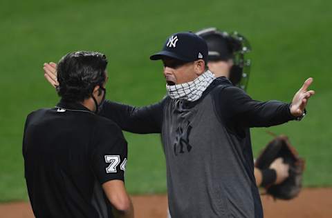 Manager Aaron Boone #17 of the New York Yankees exchanges words with umpire John Tumpane #74 after he is ejected from the game during the first inning against the Miami Marlins at Yankee Stadium on September 25, 2020 in the Bronx borough of New York City. (Photo by Sarah Stier/Getty Images)