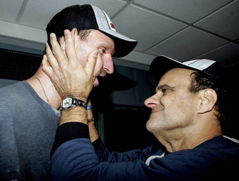 Randy Johnson #41 (L) and manager Joe Torre celebrate in the locker room after the New York Yankees clinched the AL East division title by defeating the Boston Red Sox at Fenway Park on October 1, 2005 in Boston, Massachusetts. The Yankees won the game 8-4. (Photo by Elise Amendola-Pool/Getty Images)